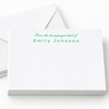 A stack of white letterhead cards with matching envelopes on a clean white background. The top card features green printed text reading 'From the disorganized desk of Emily Johnson'.