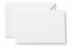 A blank white rectangular card or paper sheet placed in front of a matching white envelope on a clean white background.