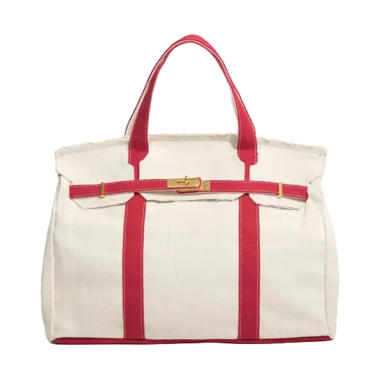 White tote bag with red straps and trim on a white background