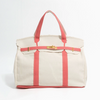 White tote bag with pink accents on a white background