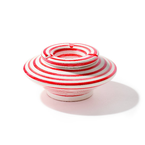 Red and white striped ceramic bowl on a white background