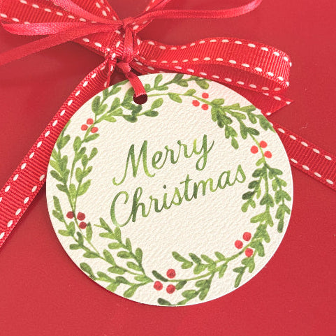 Red gift box with a 'Merry Christmas' tag and ribbon