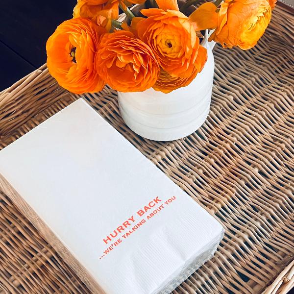 A paper hand towel with the text 'HURRY BACK.
