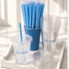 Clear plastic cups with blue straws and 'TO GO' text on a white tray.